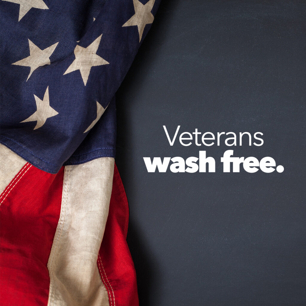 Veterans Wash free in white text next to an American flag. 