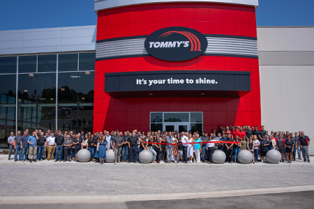 Ribbon cutting ceremony at Tommy's Express headquarters in 2023
